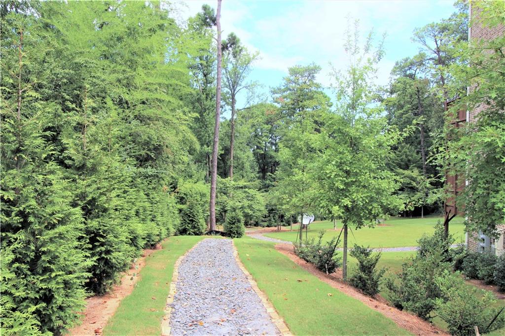 1980 Raven Way Chamblee, GA 30341 - Photo 47 of 51 a view of a pathway both side of yard