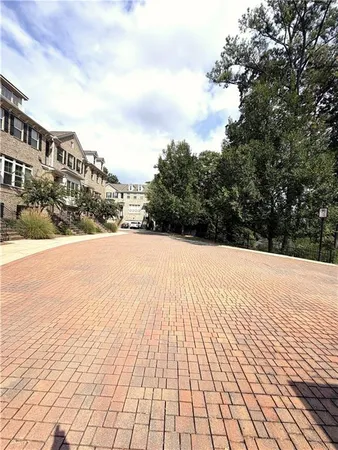 a street view of a building with snow on the road