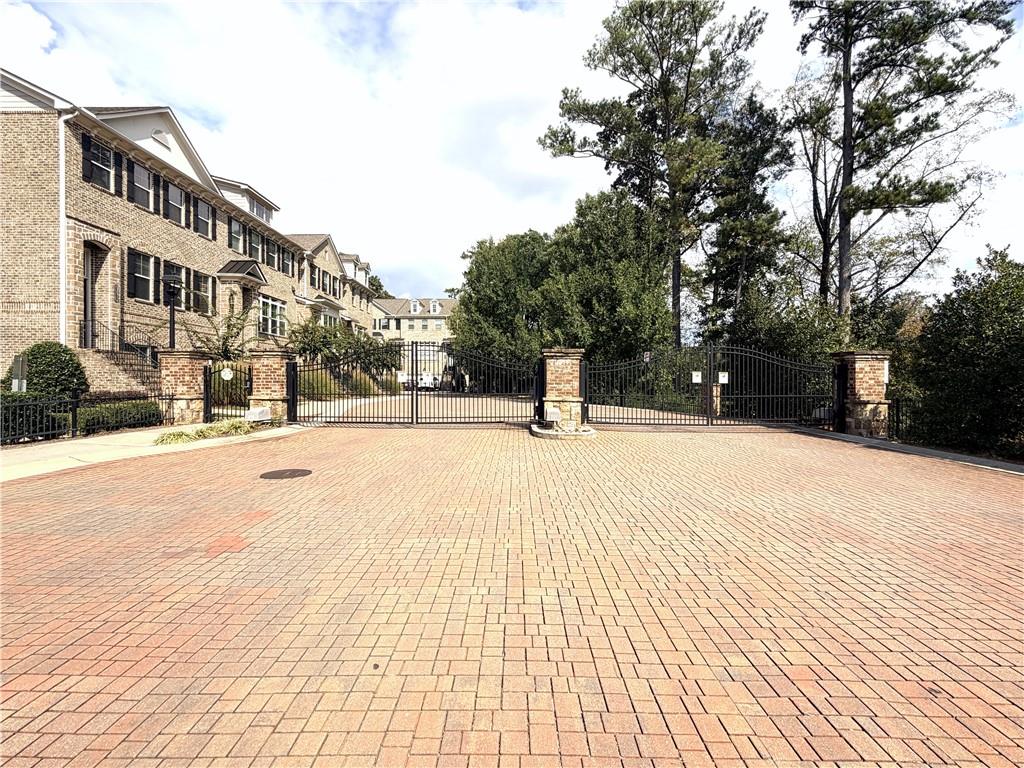 1980 Raven Way Chamblee, GA 30341 - Photo 50 of 51 a street view of a building with snow on the road