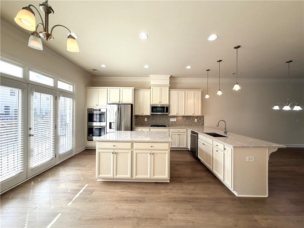 1980 Raven Way Chamblee, GA 30341 - Photo 6 of 51 a large kitchen with lots of counter space wooden floor and appliances