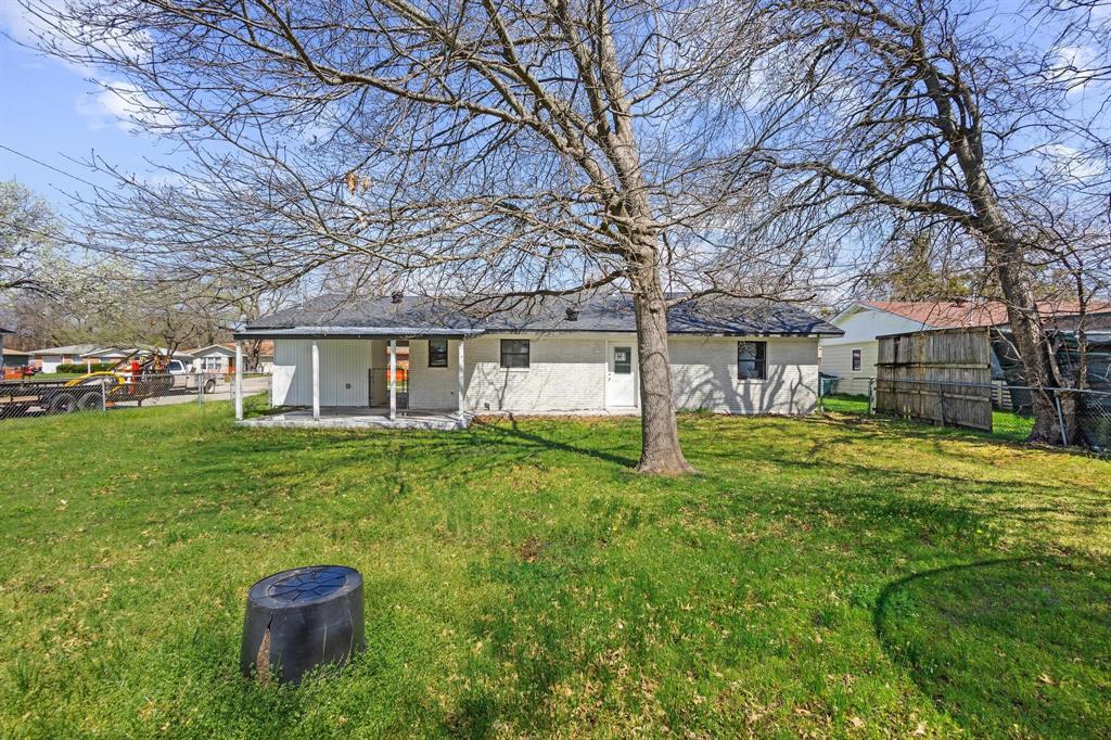 1704 Harris Street Gainesville, TX 76240 - Photo 20 of 21 Rear view of property featuring a patio area