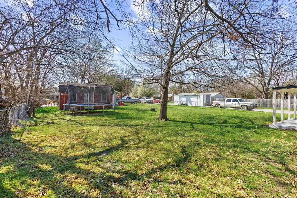 1704 Harris Street Gainesville, TX 76240 - Photo 21 of 21 View of yard featuring a trampoline