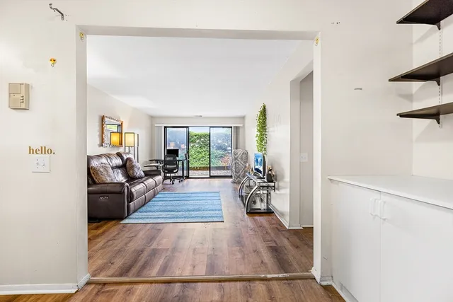 a view of a living room and hardwood floor