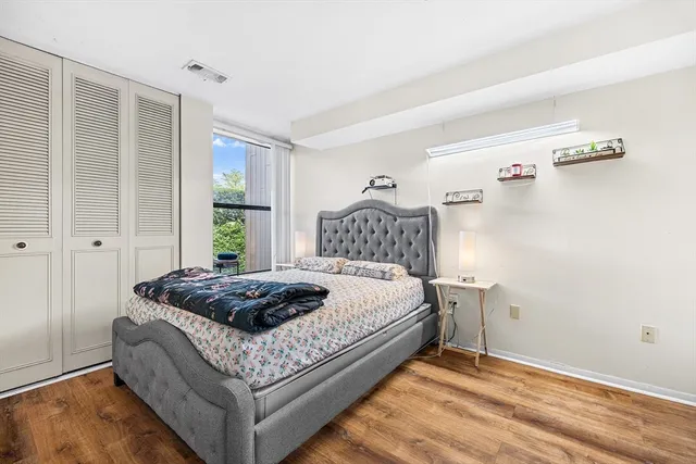 a bedroom with a bed and window