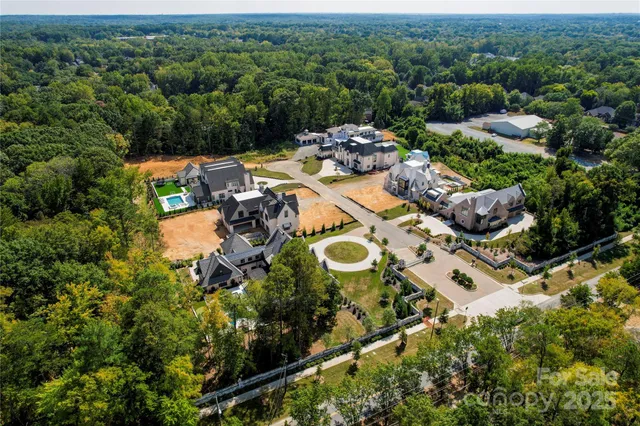 an aerial view of a house with yard swimming pool outdoor seating and yard