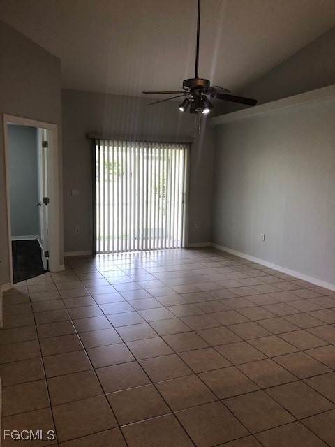 4122 Southwest 7th Place Cape Coral, FL 33914 - Photo 7 of 9 a view of an empty room with a window