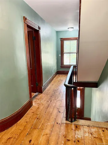 a view of a livingroom with furniture and window