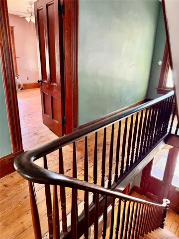 a view of a balcony with wooden floor