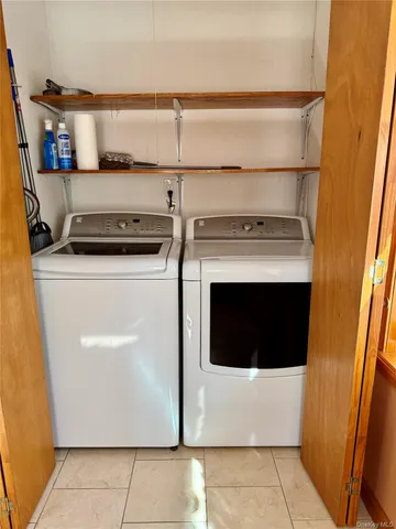 a utility room with washer and dryer