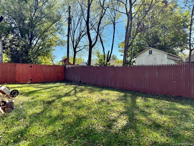 a view of backyard with tree