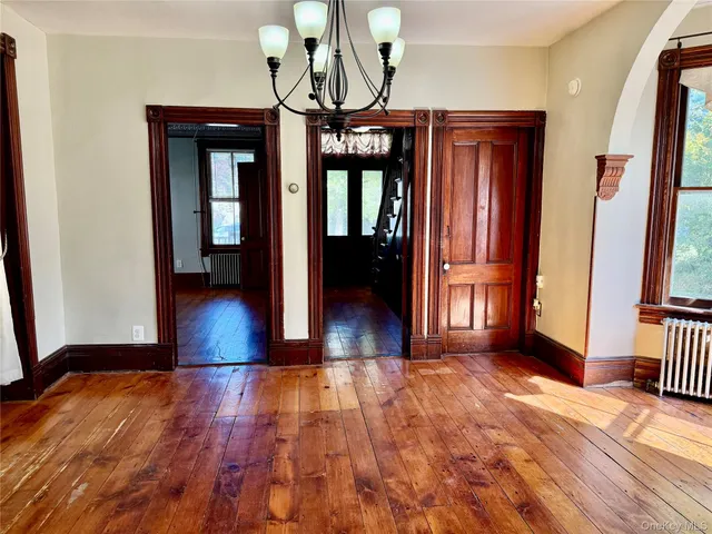 a view of gallery with wooden floor