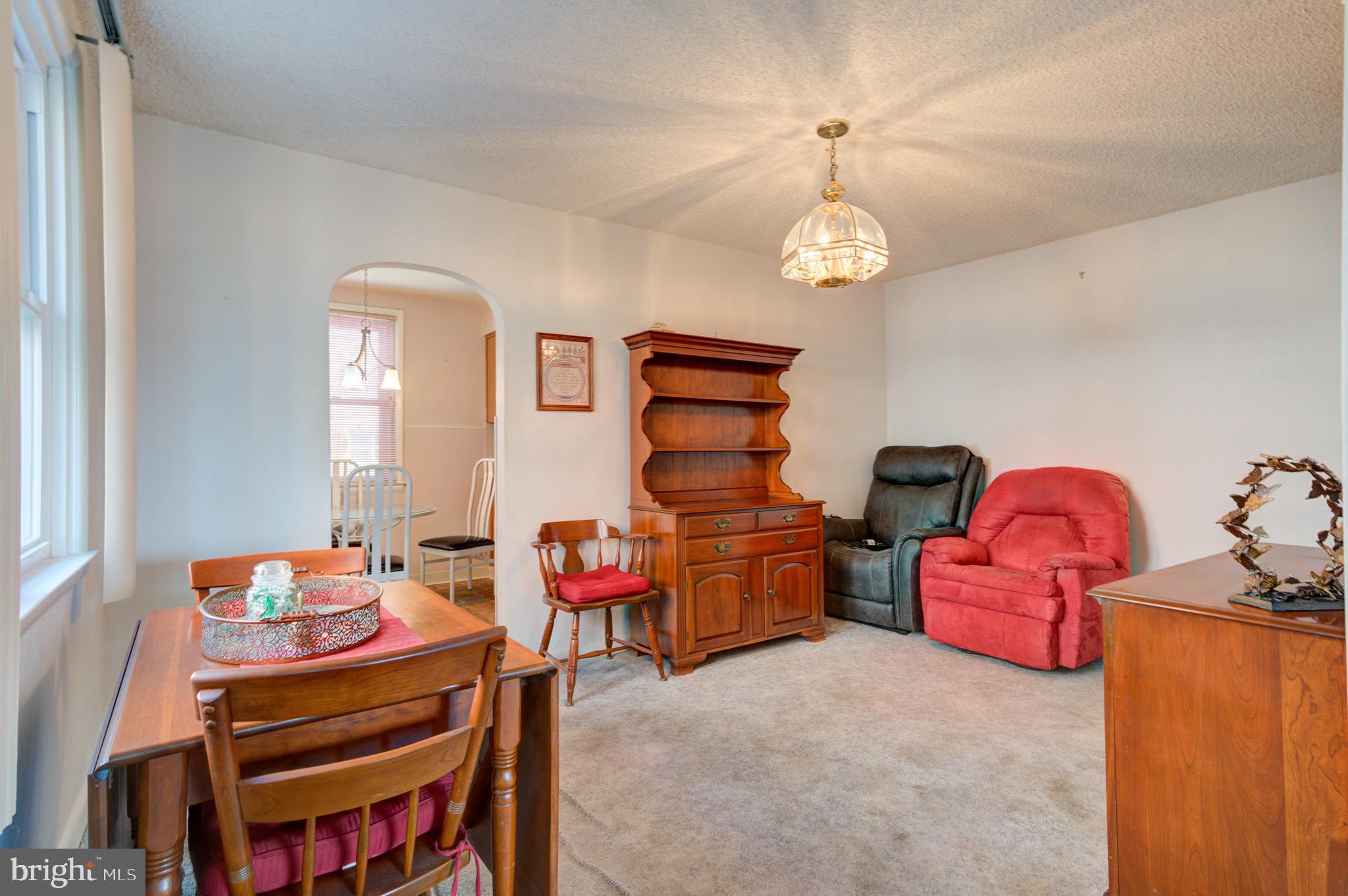 9075 Convent Avenue Philadelphia, PA 19136 - Photo 13 of 17 a bedroom with furniture and a chandelier