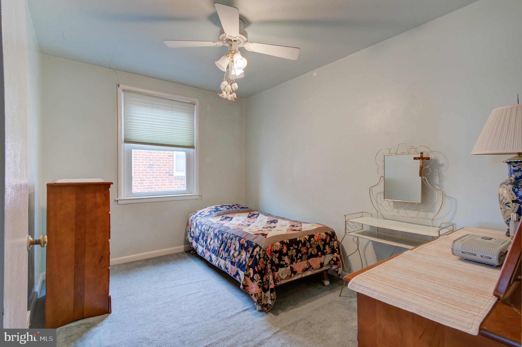 9075 Convent Avenue Philadelphia, PA 19136 - Photo 14 of 17 a bedroom with a bed and a table in it
