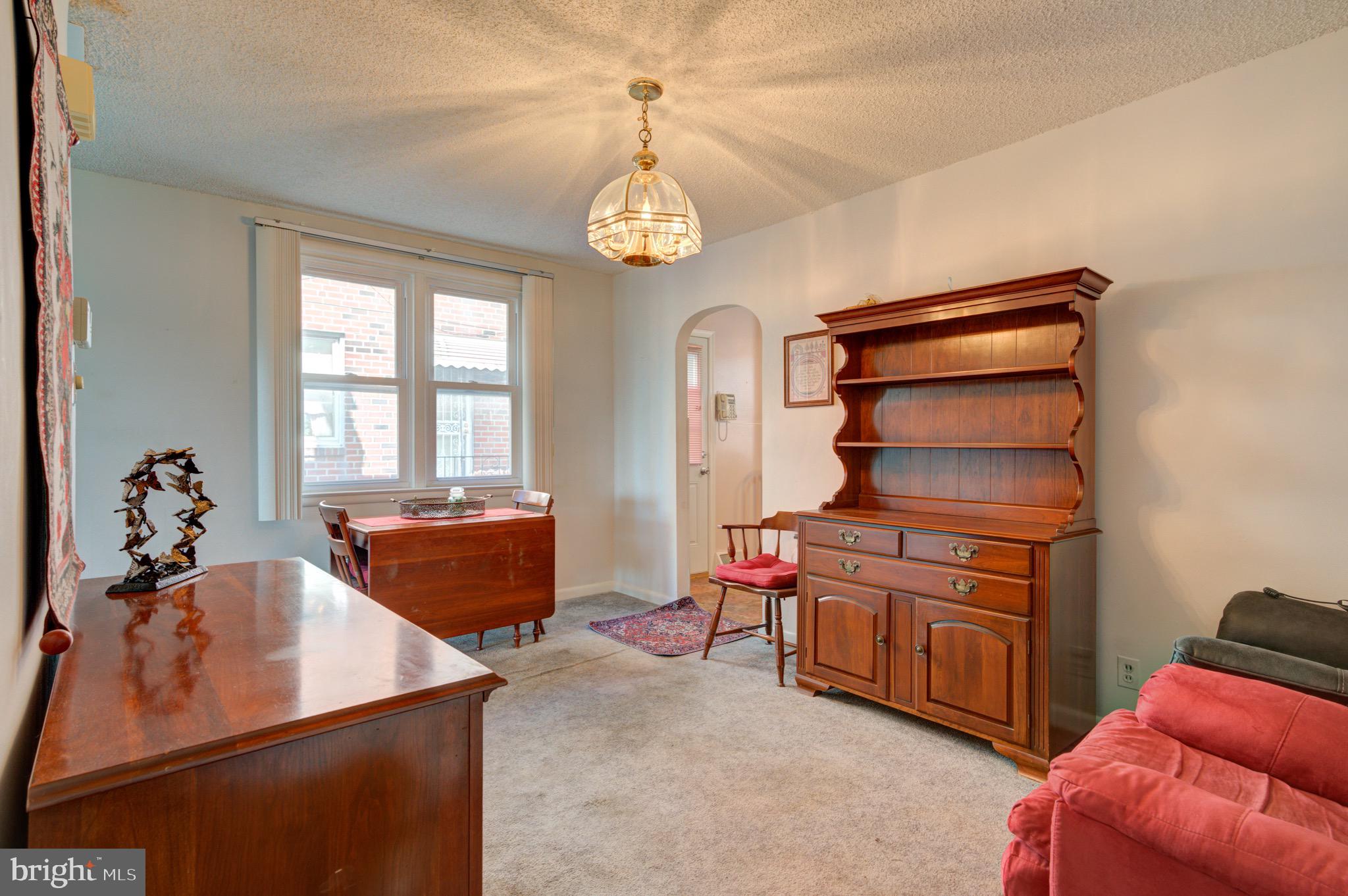 9075 Convent Avenue Philadelphia, PA 19136 - Photo 16 of 17 a living room with furniture and a window