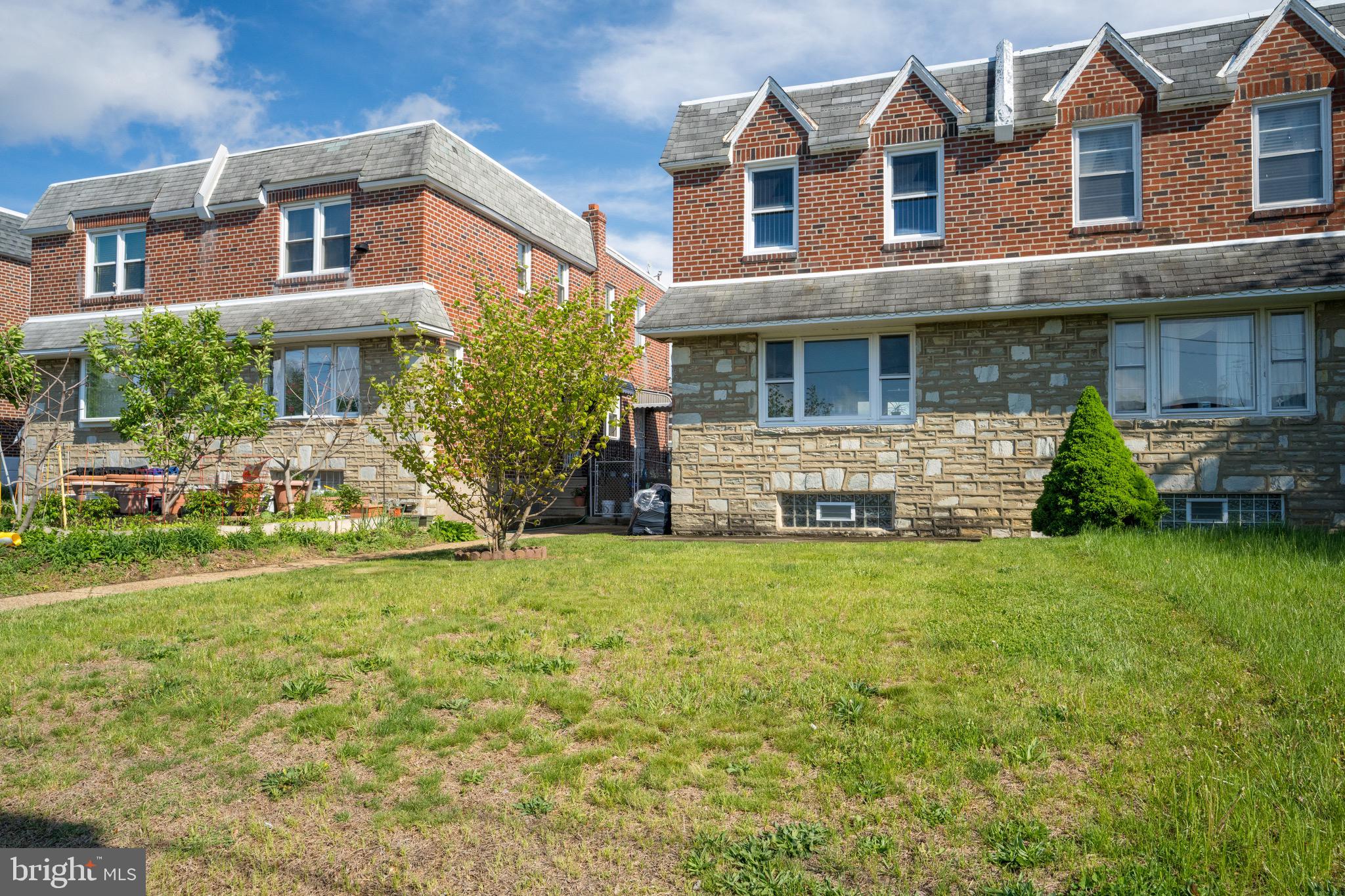 9075 Convent Avenue Philadelphia, PA 19136 - Photo 2 of 17 a front view of a house with garden