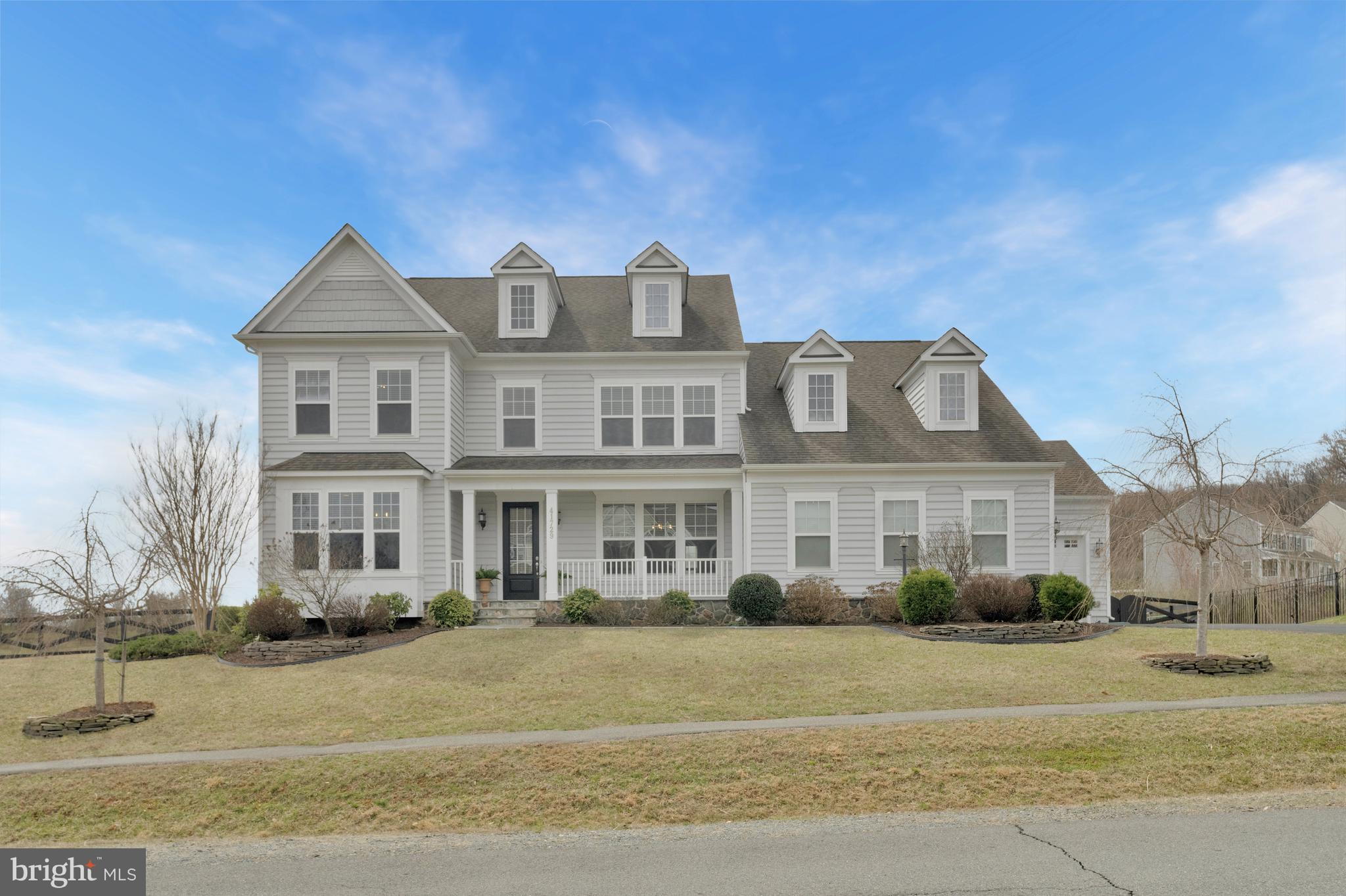 41729 Wakehurst Place Leesburg, VA 20176 - Photo 1 of 71 a front view of a house with a garden