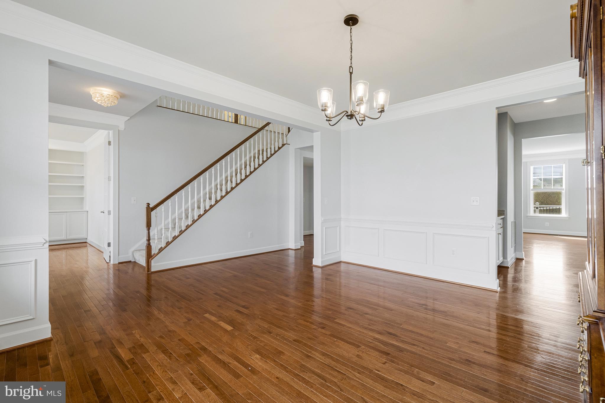 41729 Wakehurst Place Leesburg, VA 20176 - Photo 12 of 71 a view of an empty room with wooden floor and staircase