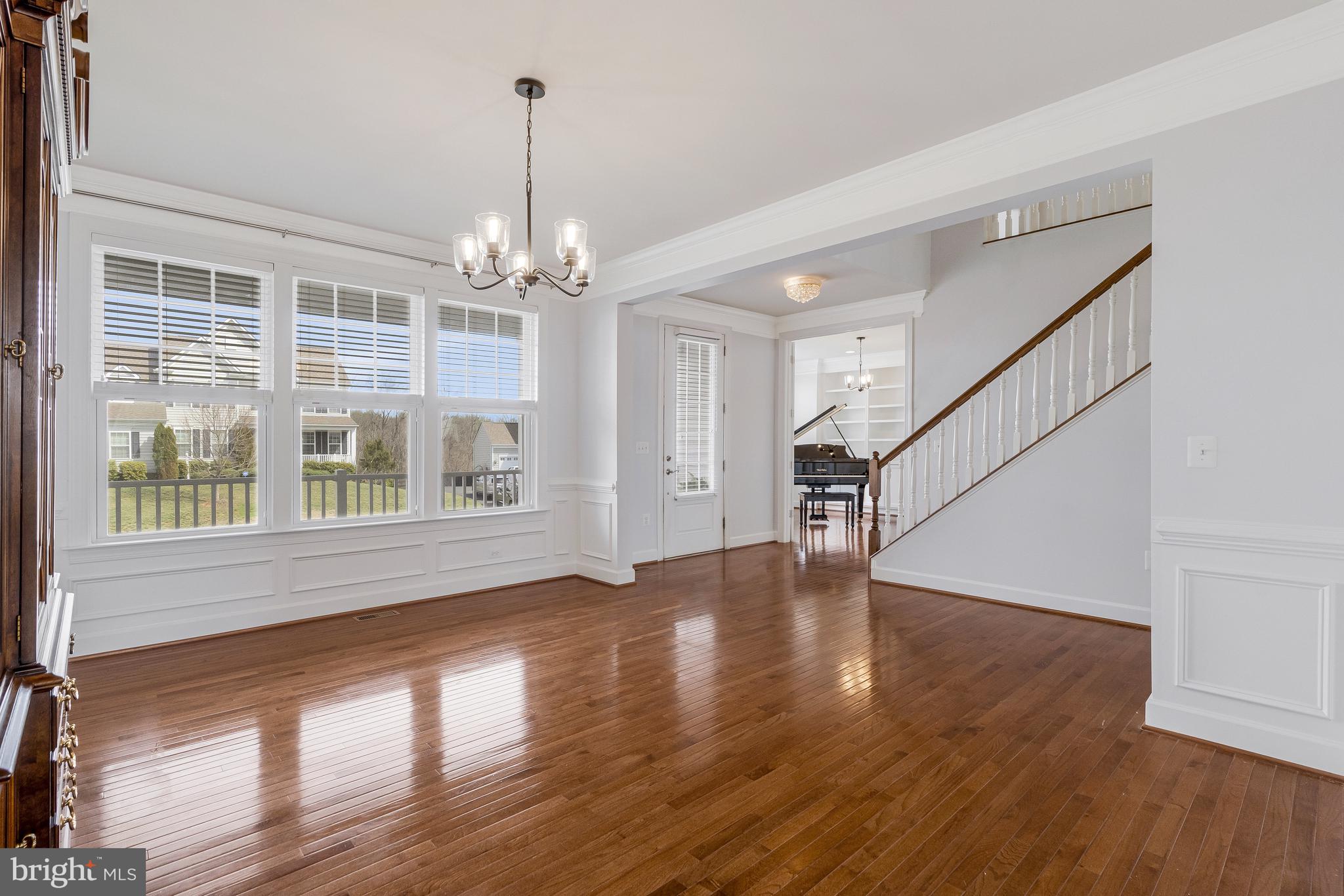 41729 Wakehurst Place Leesburg, VA 20176 - Photo 13 of 71 a view of an room with wooden floor chandelier and windows