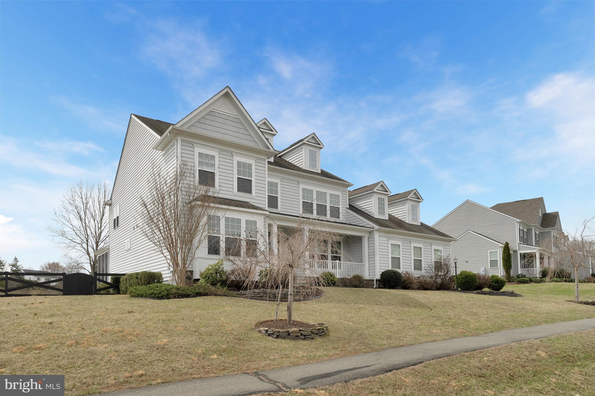 41729 Wakehurst Place Leesburg, VA 20176 - Photo 2 of 71 a front view of a house with a yard