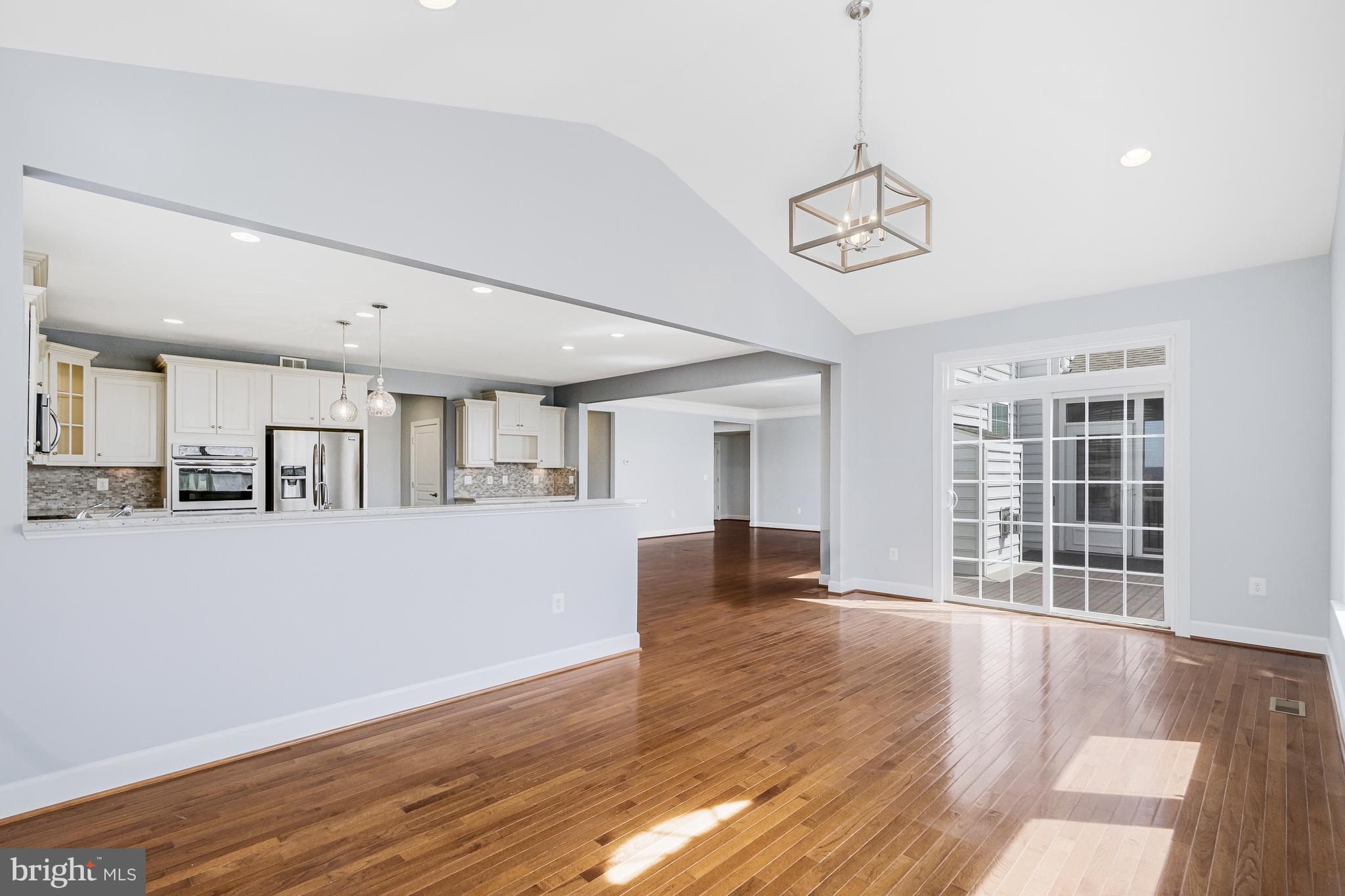 41729 Wakehurst Place Leesburg, VA 20176 - Photo 26 of 71 a view of an empty room with wooden floor and a window