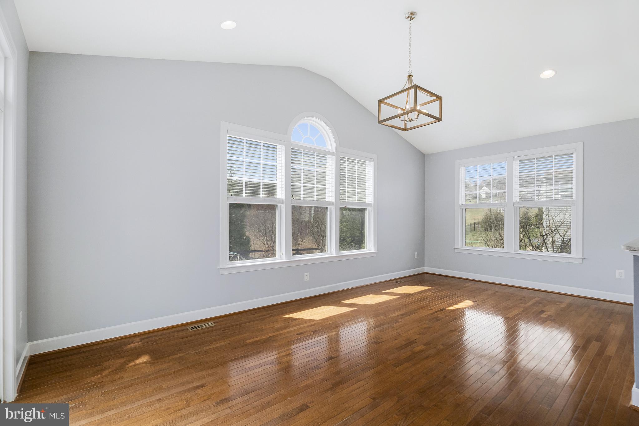 41729 Wakehurst Place Leesburg, VA 20176 - Photo 27 of 71 a view of an empty room with wooden floor and a window