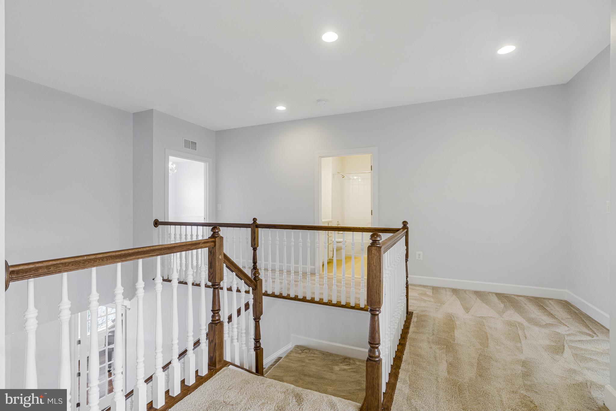 41729 Wakehurst Place Leesburg, VA 20176 - Photo 41 of 71 a view of staircase with railing and white walls