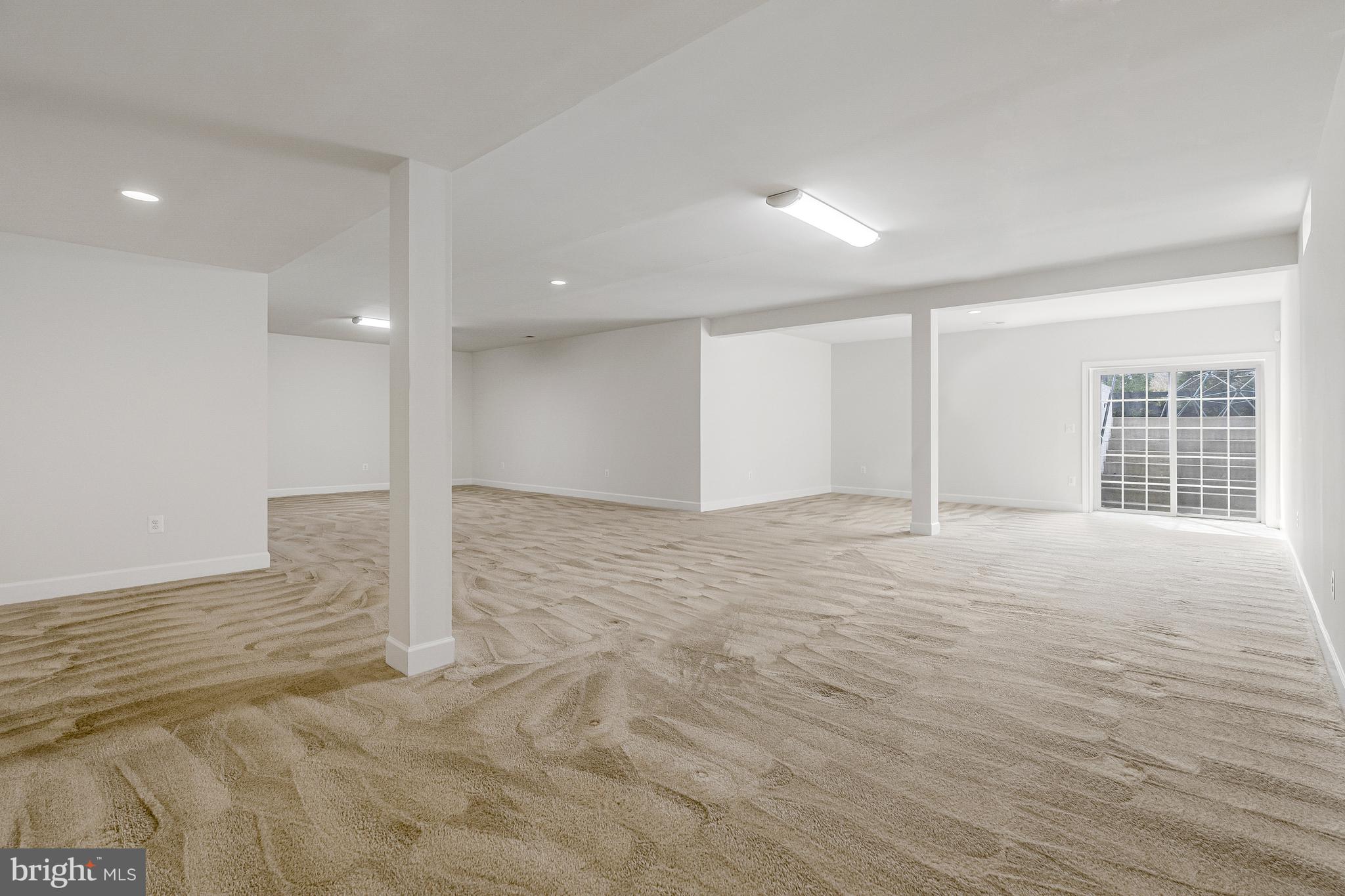 41729 Wakehurst Place Leesburg, VA 20176 - Photo 55 of 71 a view of an empty room with wooden floor and a window