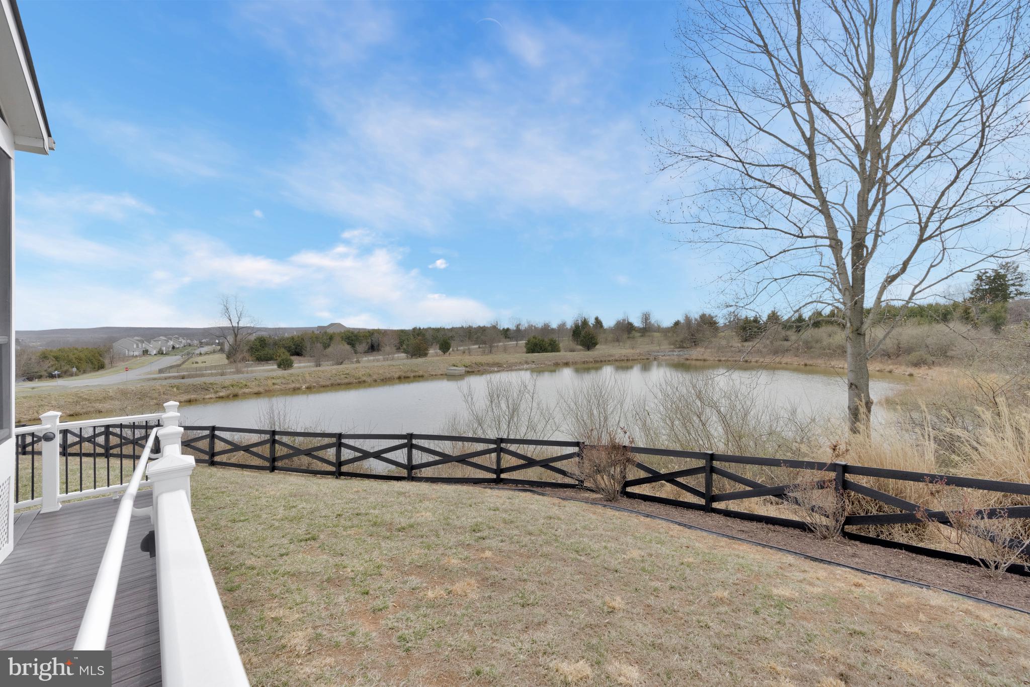 41729 Wakehurst Place Leesburg, VA 20176 - Photo 66 of 71 a view of a lake with houses in the back