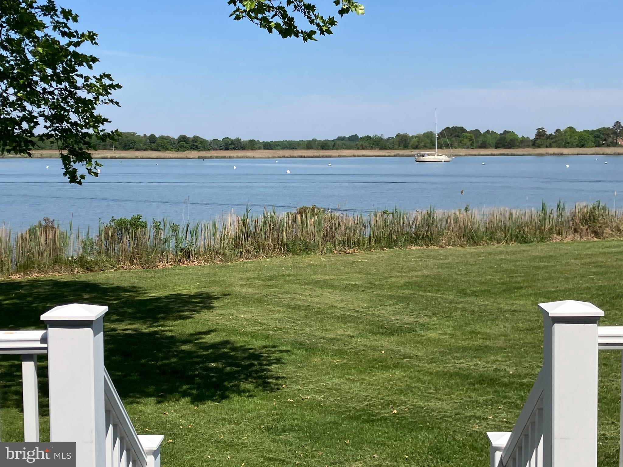6119 New Street, Unit 2 Rock Hall, MD 21661 - Photo 20 of 44 a view of a lake with a mountain in the background