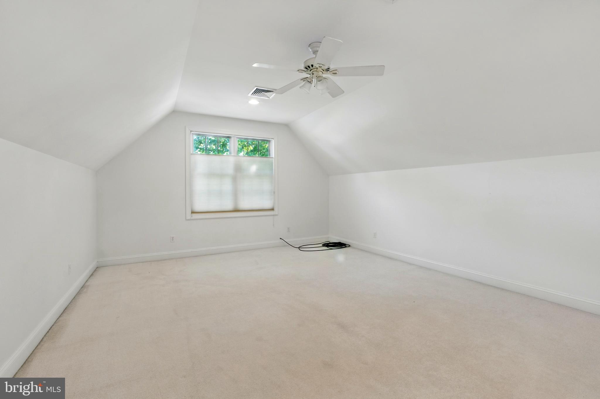 6119 New Street, Unit 2 Rock Hall, MD 21661 - Photo 32 of 44 an empty room with windows and fan