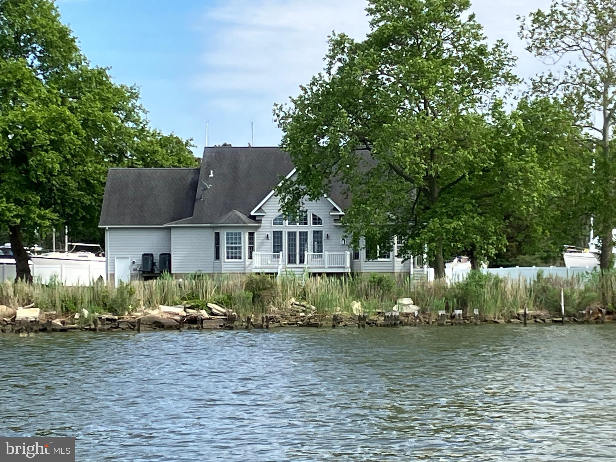 6119 New Street, Unit 2 Rock Hall, MD 21661 - Photo 36 of 44 a front view of a house with garden