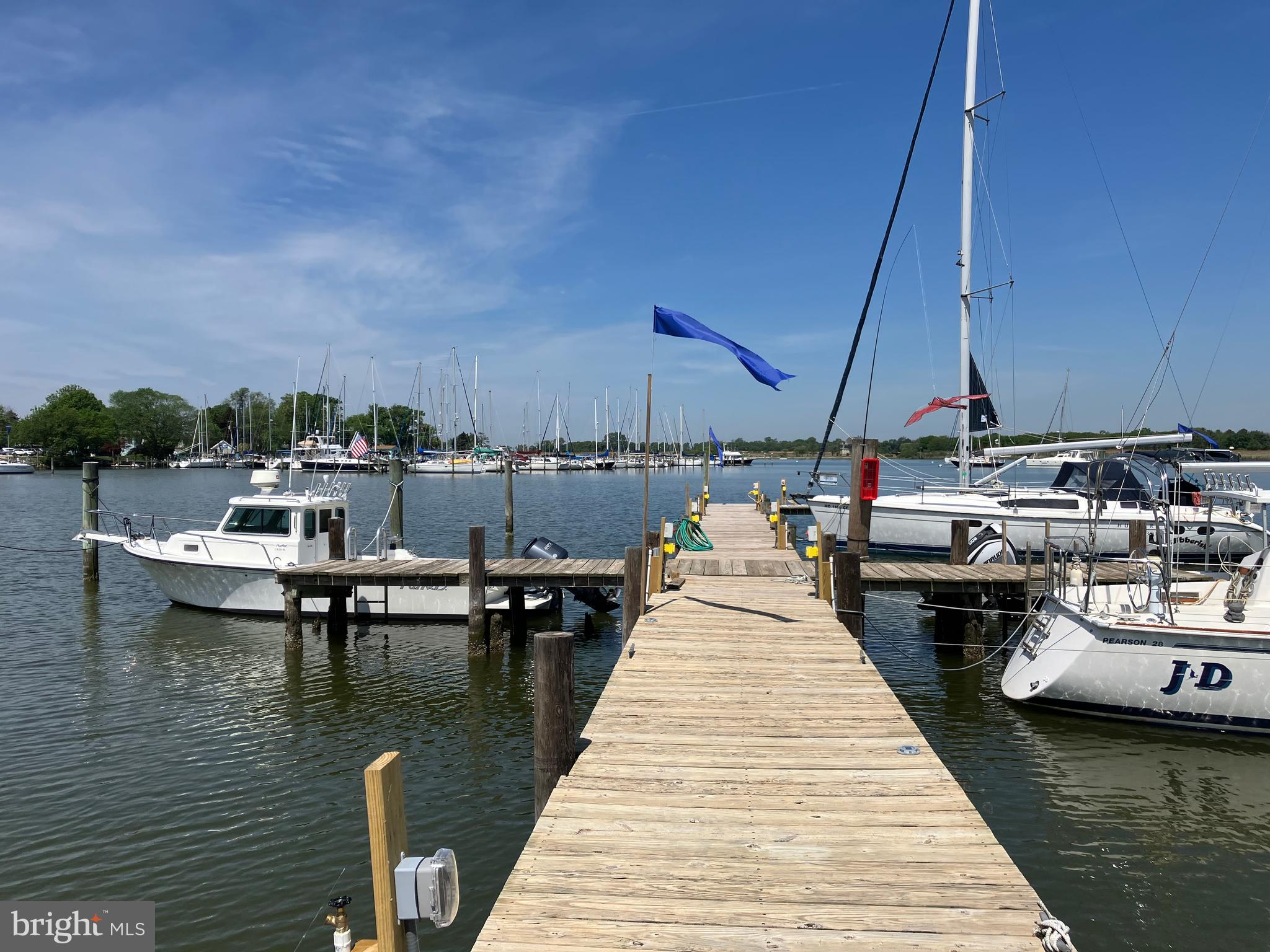 6119 New Street, Unit 2 Rock Hall, MD 21661 - Photo 37 of 44 a close up of a lake with boats and trees