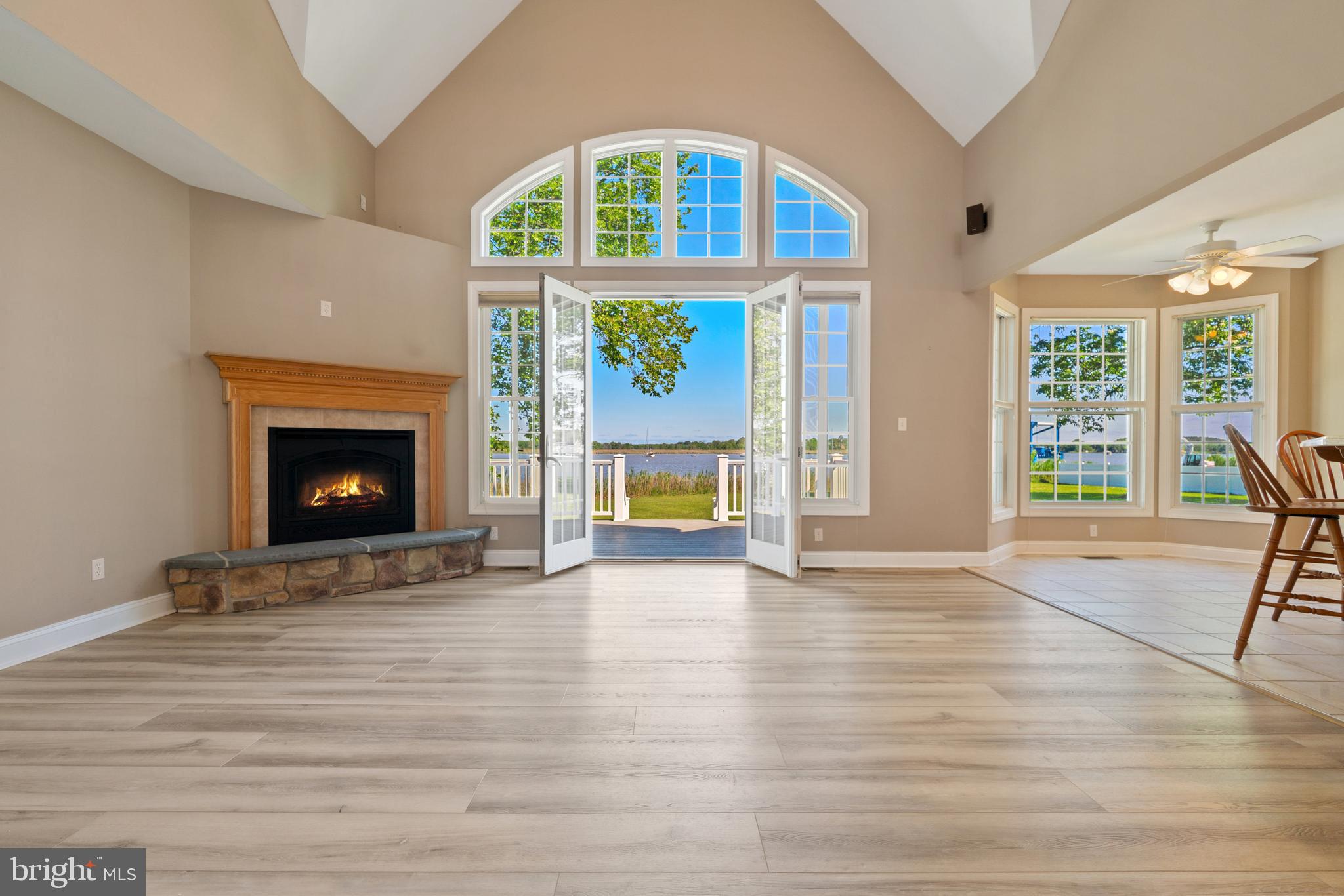 6119 New Street, Unit 2 Rock Hall, MD 21661 - Photo 44 of 44 a view of an empty room with a fireplace and a window