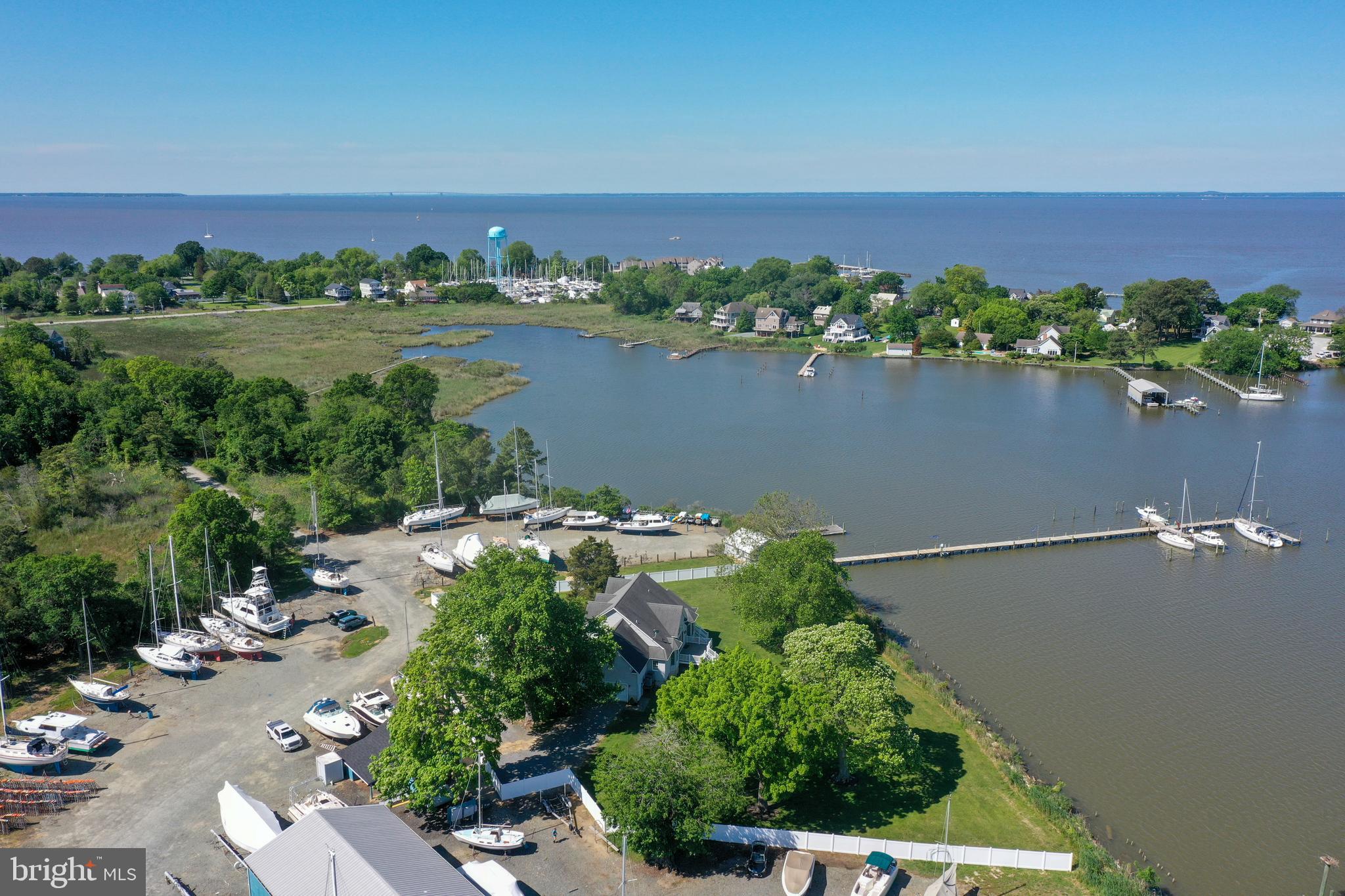 6119 New Street, Unit 2 Rock Hall, MD 21661 - Photo 41 of 44 an aerial view of a house with a lake view