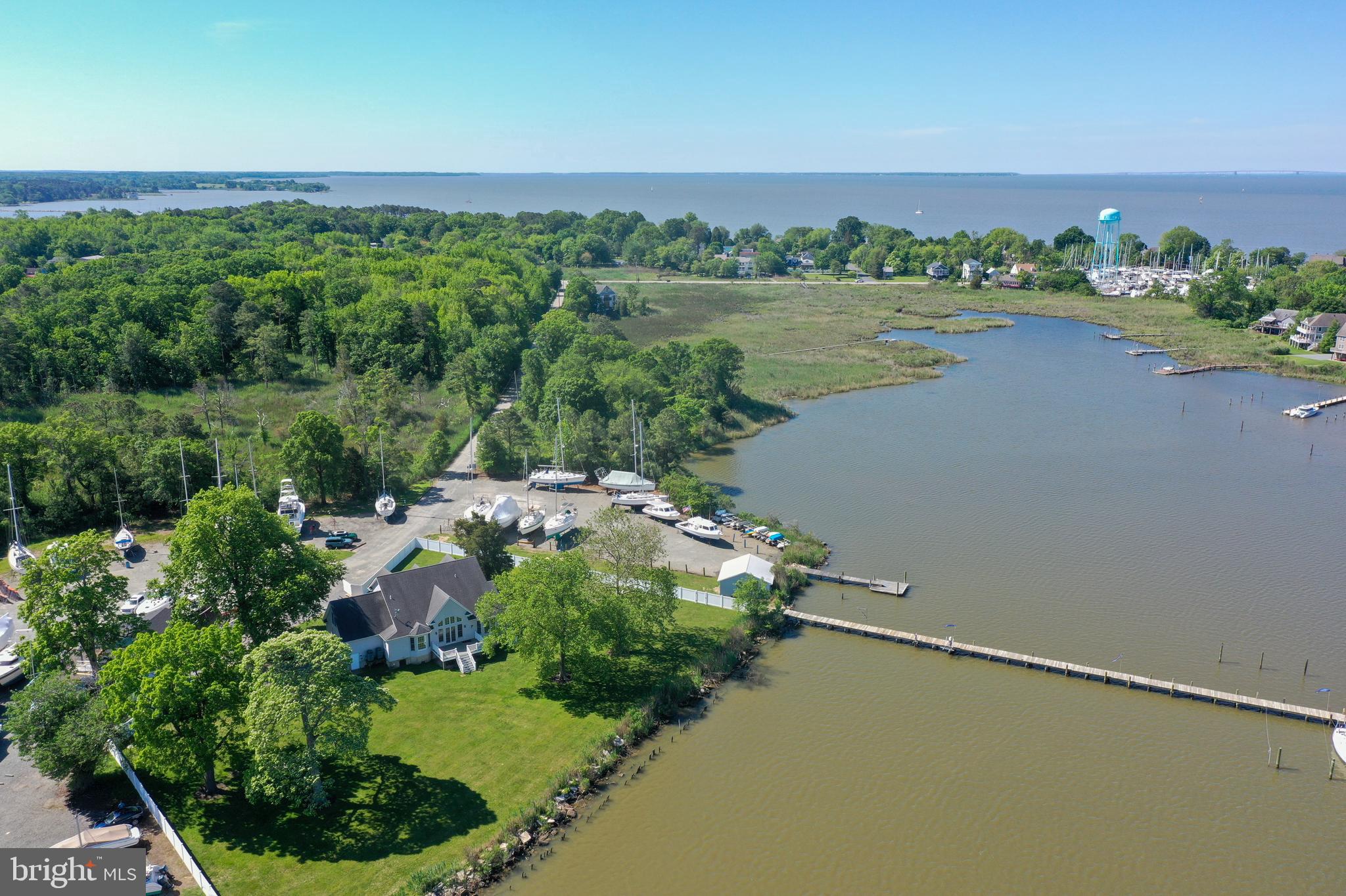 6119 New Street, Unit 2 Rock Hall, MD 21661 - Photo 42 of 44 an aerial view of a residential houses with outdoor space and lake view