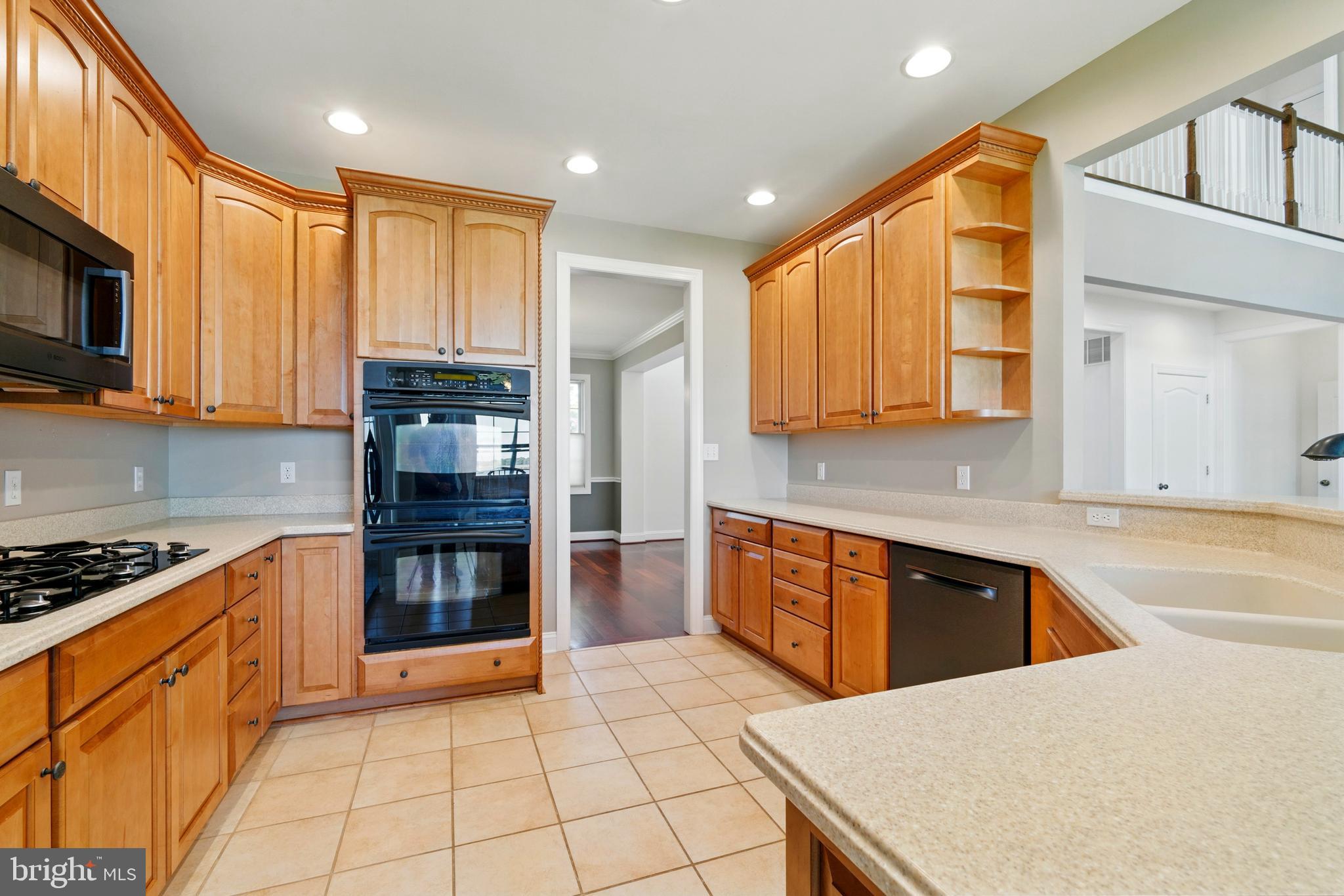 6119 New Street, Unit 2 Rock Hall, MD 21661 - Photo 8 of 44 a kitchen with stainless steel appliances granite countertop a stove a sink and a microwave