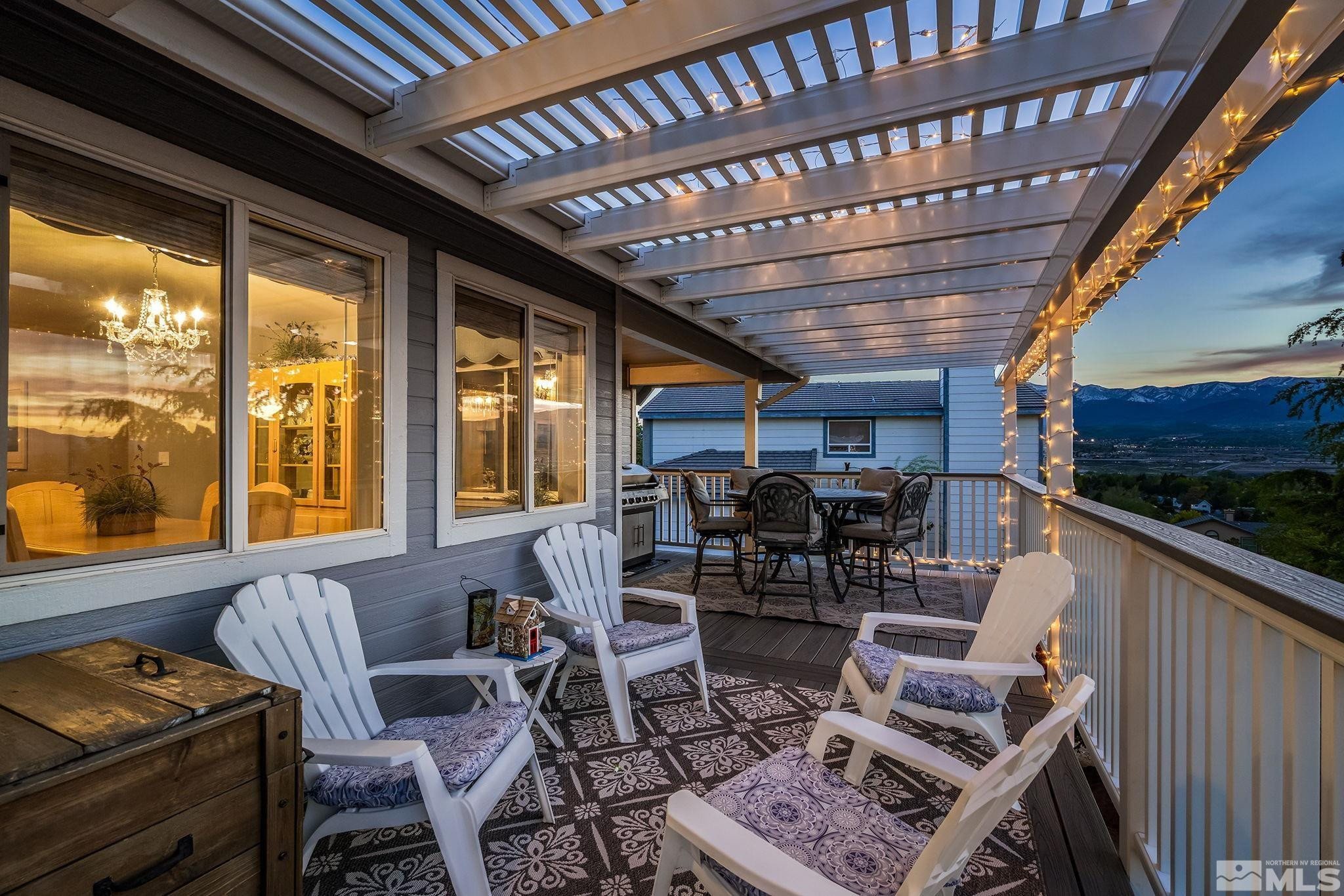 1415 Sioux Trail Reno, NV 89521 - Photo 15 of 40 a living room with furniture a flat screen tv and a floor to ceiling window