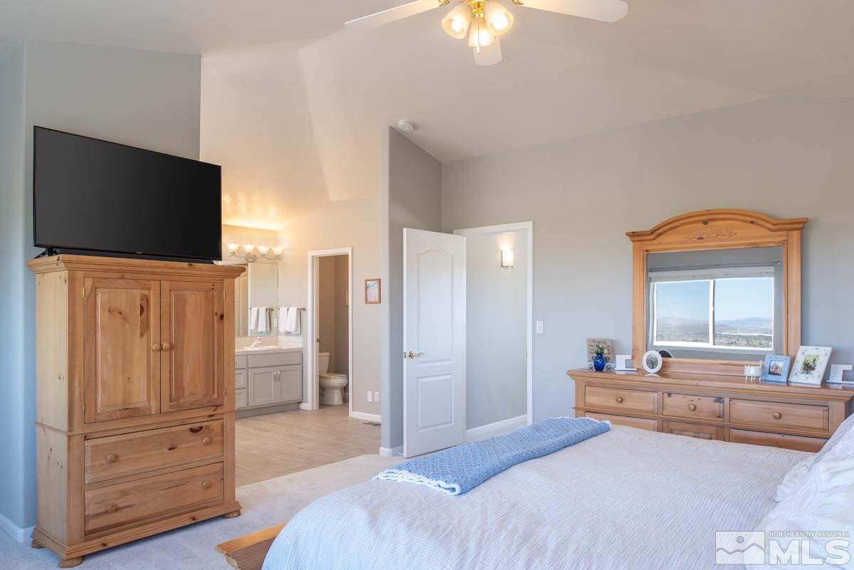 1415 Sioux Trail Reno, NV 89521 - Photo 17 of 40 a bedroom with furniture and a flat screen tv