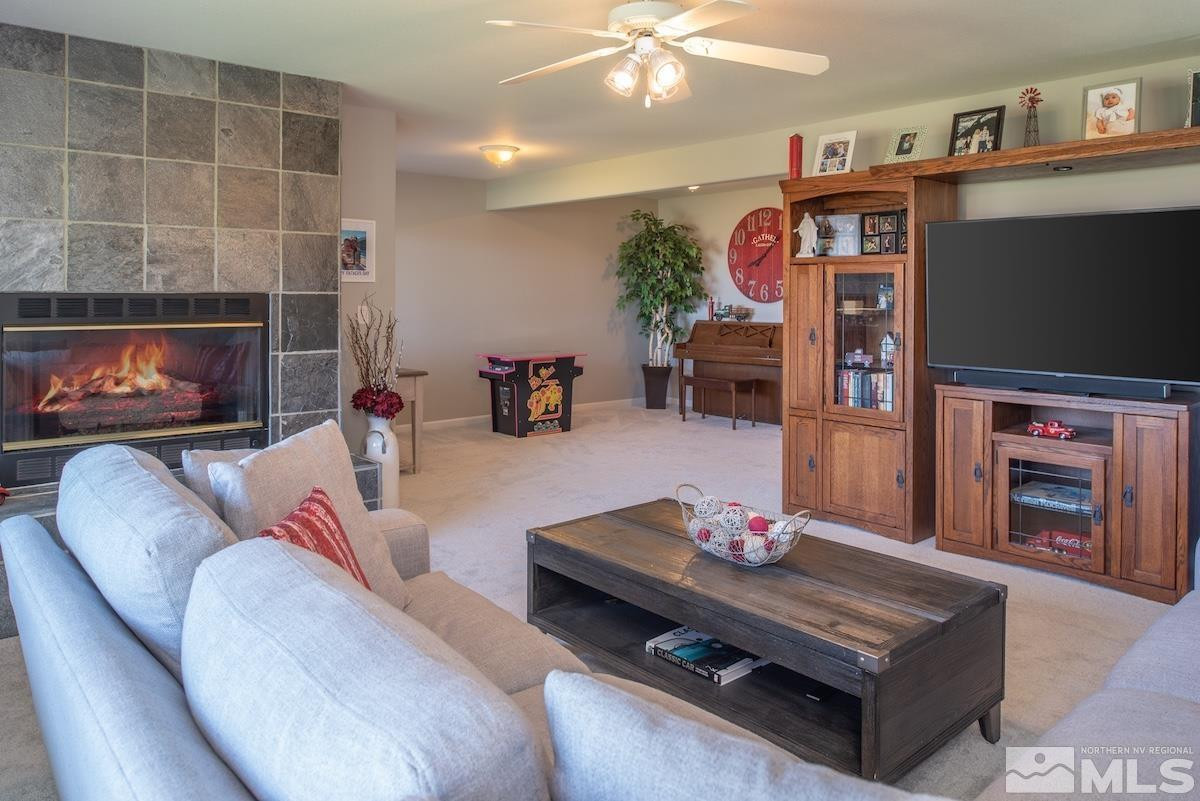 1415 Sioux Trail Reno, NV 89521 - Photo 23 of 40 a living room with furniture and a fireplace