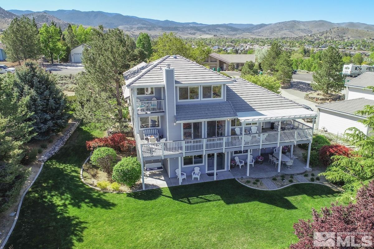 1415 Sioux Trail Reno, NV 89521 - Photo 3 of 40 a view of a house with a big yard plants and large trees