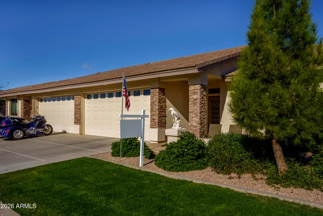 a view of a car parked in front of house