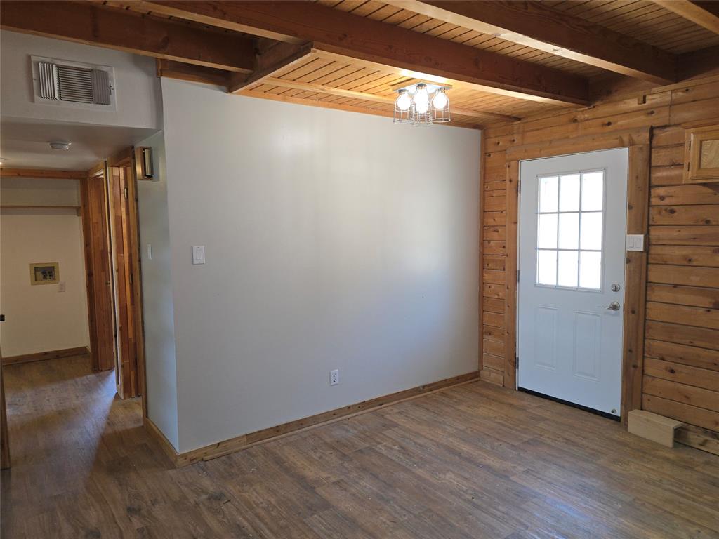 3505 Farmer Road Azle, TX 76020 - Photo 10 of 40 Dining area near the kitchen, backyard access, and downstairs hallway.