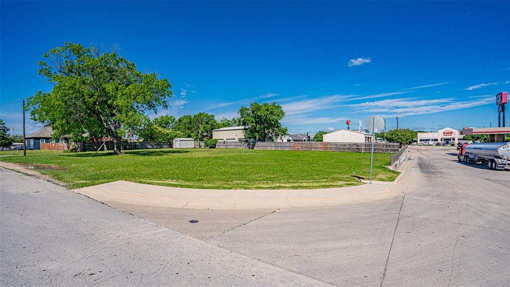 124 Southwest Anderson Street Burleson, TX 76028 - Photo 26 of 36 a view of a house with a outdoor space