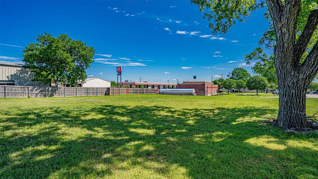 124 Southwest Anderson Street Burleson, TX 76028 - Photo 30 of 36 a view of a house with a big yard