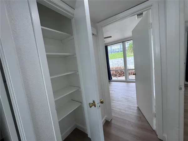 a bathroom with a sink a toilet a mirror and vanity