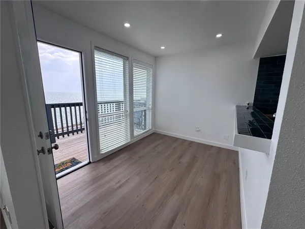 a room with a bed and a stove top oven