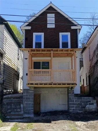 a front view of a house with a garage
