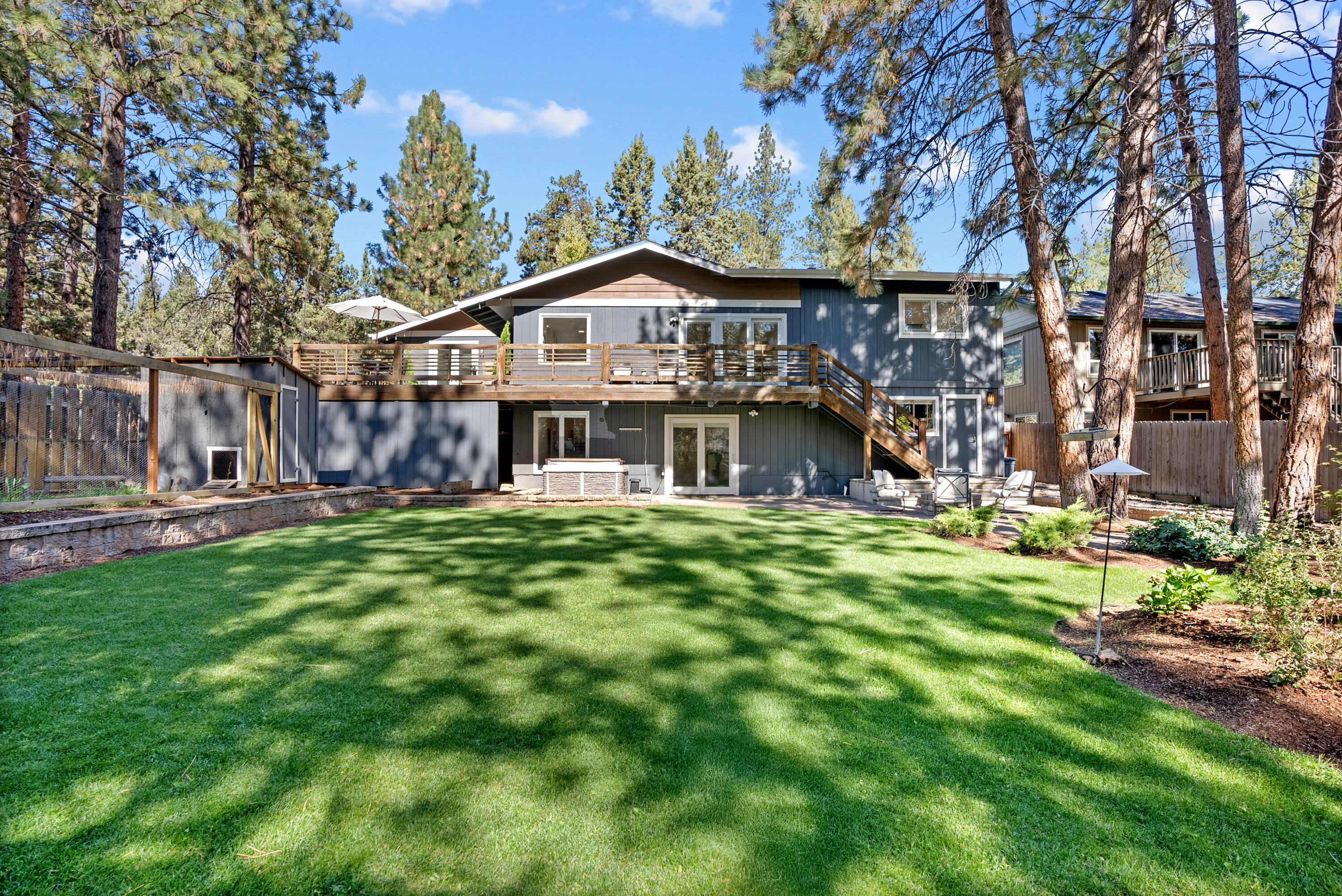 1961 Southwest Knoll Avenue Bend, OR 97702 - Photo 47 of 53 a view of a big house with a big yard plants and large trees