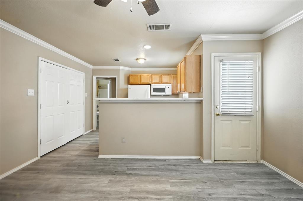 1321 Village Garden Azle, TX 76020 - Photo 5 of 20 an empty room with wooden floor and windows