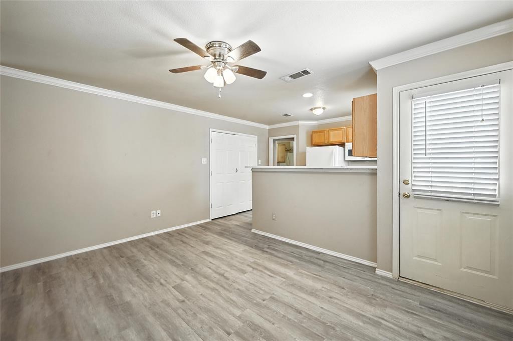 1321 Village Garden Azle, TX 76020 - Photo 6 of 20 wooden floor in an empty room with a window